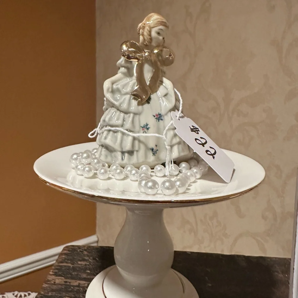 Elegant White and Gold Ceramic Figurine